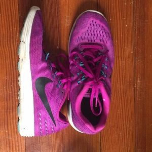 Purple Nike running shoes.